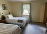 Carpeted bedroom with baseboards
