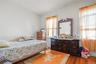 Bedroom with wood finished floors