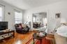 Living room featuring ornamental molding and baseboards