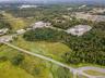 View of property location featuring a forest