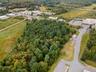Aerial view of property's location with a forest