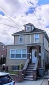 View of front of home with brick siding and stucco siding
