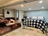 Bedroom with ornamental molding and recessed lighting