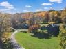 View from above of property with a heavily wooded area