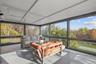 Sunroom / solarium featuring an outdoor living space and healthy amount of natural light