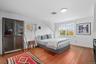 Bedroom featuring light wood-style floors and baseboards