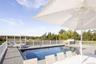 2100 square foot deck with 32' x 16' heated, saltwater Gunite pool with cover