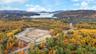 Bird's eye view of a forest and a water and mountain view