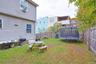 Fenced backyard with a trampoline and a patio area
