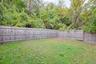 View of fenced backyard