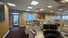 Office space with a paneled ceiling