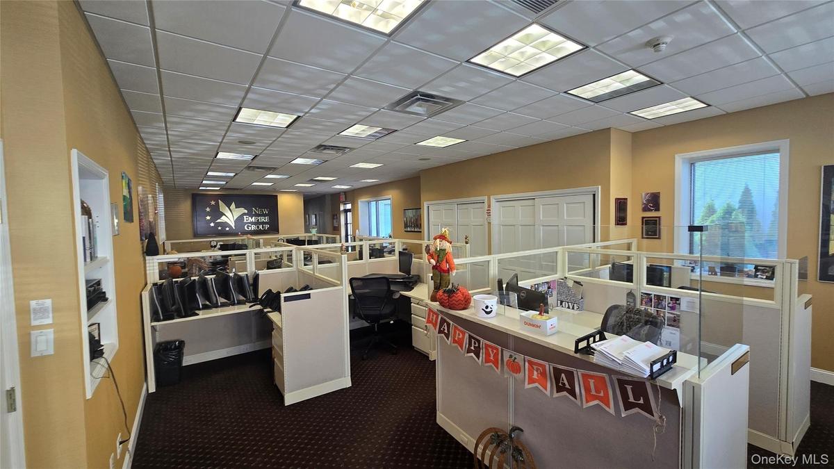 Office featuring a drop ceiling