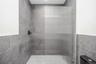 Bathroom featuring tiled shower