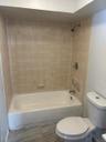 Bathroom with toilet and shower / bathtub combination