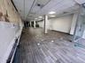 Finished below grade area with a drop ceiling and dark wood-type flooring