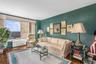 Living room featuring radiator and parquet flooring