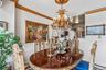 Dining space featuring ornamental molding and a chandelier