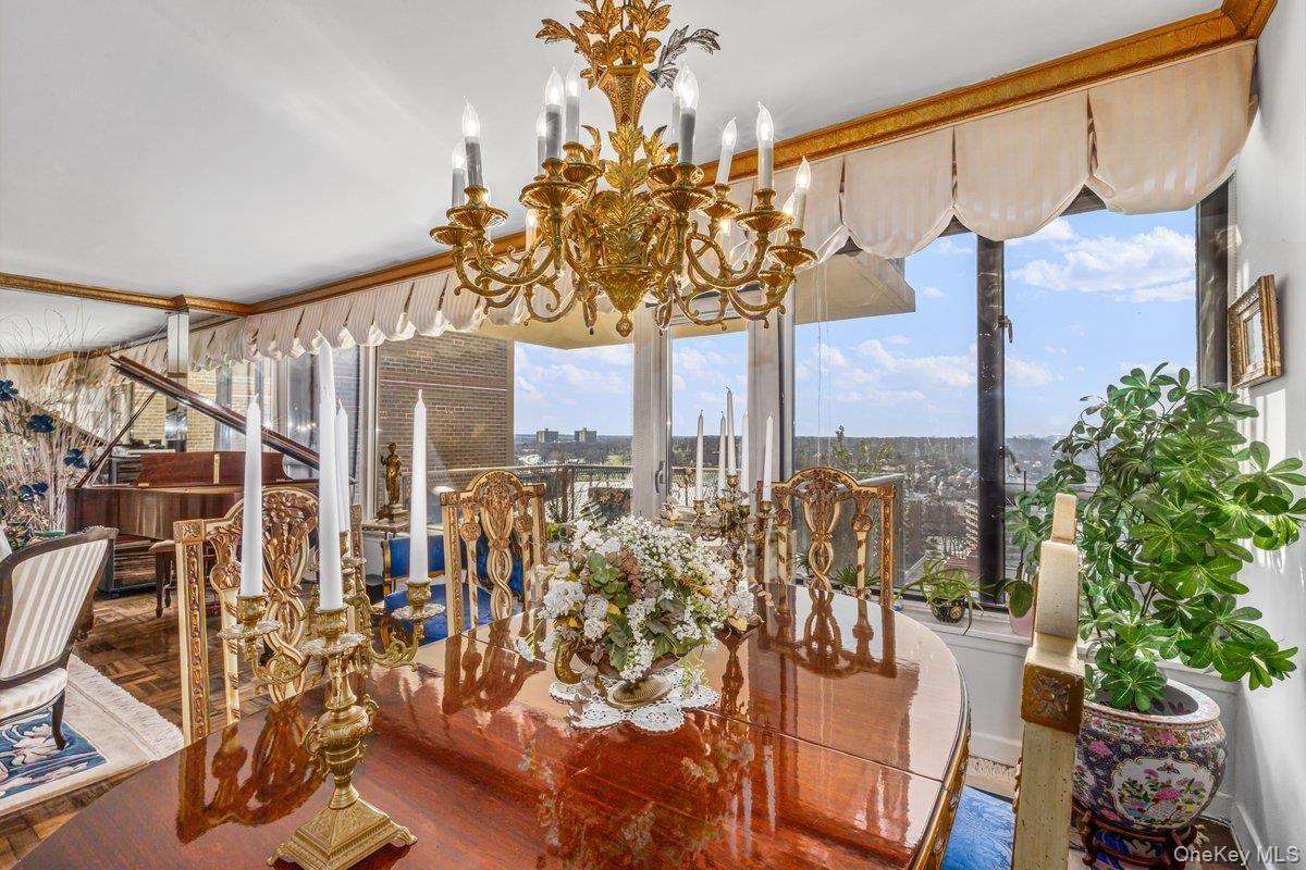 Dining area with healthy amount of natural light and a chandelier