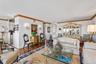 Living room featuring crown molding and baseboards