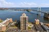 Drone / aerial view of a nearby body of water and a notable bridge