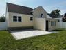 Rear view of house with a patio and a shingled roof