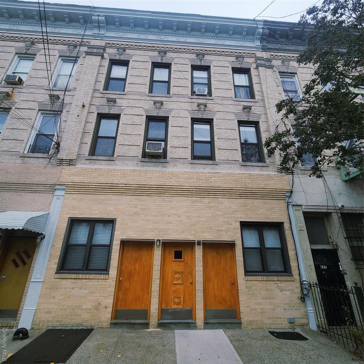 View of front of property featuring brick siding