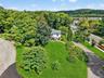 View from above of property featuring a heavily wooded area