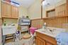 Bathroom featuring vanity and baseboard heating