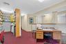 Office area featuring carpet flooring and baseboards