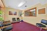 Sitting room with a baseboard radiator and carpet flooring
