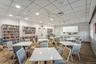 Dining space featuring wood finished floors, a paneled ceiling, recessed lighting, and crown molding
