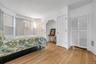Bedroom featuring crown molding and light wood finished floors