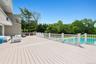 Deck featuring an outdoor hangout area and view of scattered trees