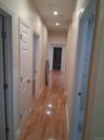 Corridor with recessed lighting and light wood finished floors