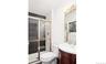 Full bath featuring vanity and a stall shower