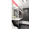 Full bathroom featuring vanity, tile patterned floors, and tiled shower / bath