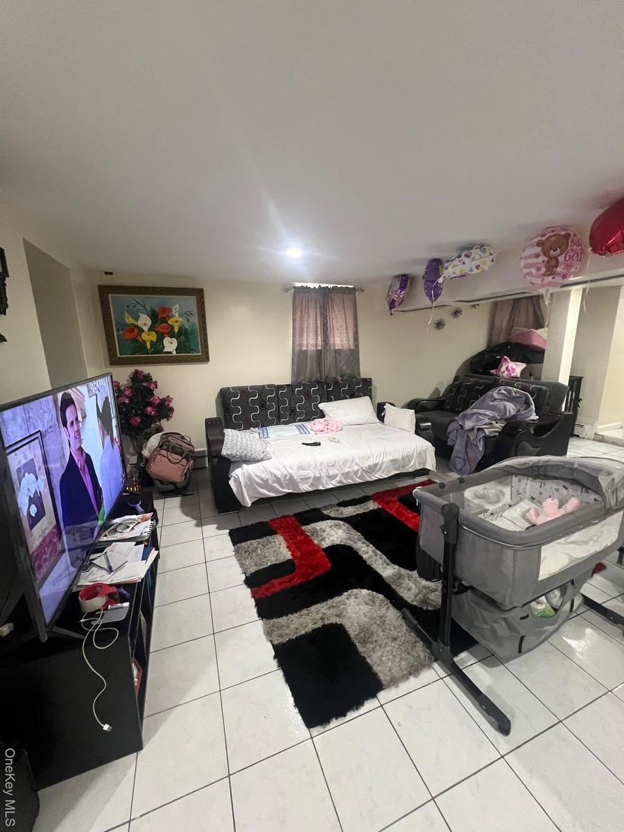 Living area with light tile patterned floors