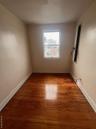 Unfurnished room with baseboards and light wood-style floors