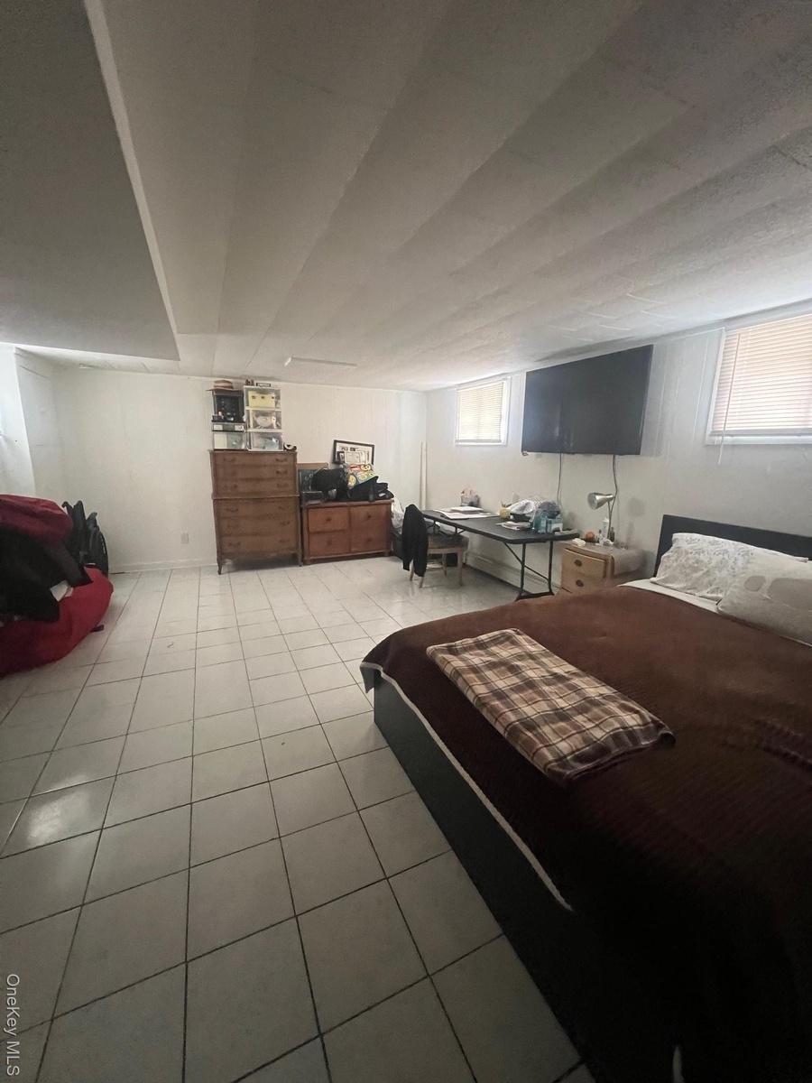 Bedroom featuring light tile patterned flooring