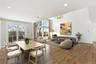 Breakfast Room open to the Chef's Kitchen and Great Room with deck access virtually staged