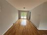 Spare room featuring a baseboard radiator and light wood-style floors
