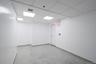 Spare room with baseboards and a paneled ceiling