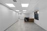 Bar area with a drop ceiling and light countertops