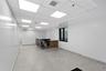 Empty room with baseboards and a paneled ceiling