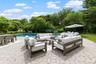 Swimming pool featuring a patio and an outdoor hangout area