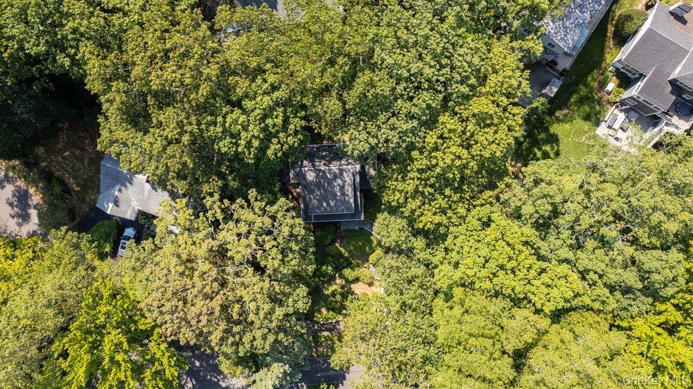 Aerial overview of property's location with a forest