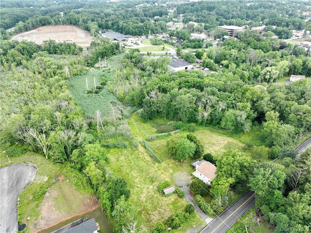 View of property location featuring a forest