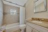 Full bathroom with tub