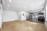Kitchen with gray cabinets, appliances with stainless steel finishes, recessed lighting, light wood-type flooring, and a wall mounted AC