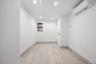 Spare room featuring recessed lighting and an AC wall unit
